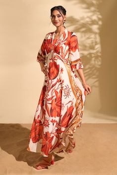 Ecru red botanical print dress with bead embroidery. - Aza Fashions Elegant Printed Floral Beach Dress, Elegant Printed Floral Dress For Beach, Elegant Beige Printed Dress, Elegant Red Printed Dress, Elegant Summer Maxi Dress With Tropical Print, Silk Red Floral Print Maxi Dress, Elegant Tropical Print Maxi Dress For Summer, Elegant Summer Dress With Tropical Print, Elegant Tropical Print Summer Dress