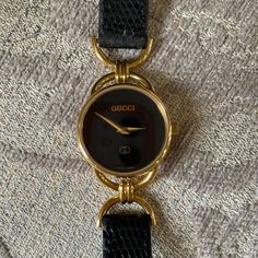 Authentic Gucci Watch With Black Leather Band. Works Perfectly And I Just Put In A Brand New Battery On 1/25/2022. In Excellent Condition. Crystal Has 2 Tiny Inclusions. Band Is In Excellent Condition. Gucci Timeless Yellow Gold Watch, Gucci Yellow Gold Watch For Formal Occasions, Gucci Yellow Gold Formal Watch, Yellow Gold Gucci Watch For Formal Occasions, Gucci Gold Jewelry With Diamond Hour Markers, Designer Gucci Watch For Evening, Gucci Watches Women, Timeless Gucci Evening Watch, Luxury Gucci Evening Watch