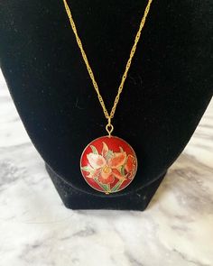 Vintage red iris cloisonné enamel puffy pendant on 18K gold plated wave chain. I cleaned the pendant to the best of my abilities. The head pin and jump ring are 18K gold plated. Comes in a box. Please keep in mind that the pendant itself is vintage so it may show some signs of age/wear which includes any signs of chipping or tarnishing. If you need a chain of another length, please select in the menu. If you need a chain length not listed, please send me a message. If you would like for me to ad Red Handmade Enamel Necklaces, Handmade Red Enamel Necklaces, Handmade Red Enamel Necklace, Red Enamel Round Pendant Necklace, Gold Enamel Round Pendant Necklace, Gold Hand-painted Round Pendant Necklace, Red Hand Painted Pendant Necklaces, Red Enamel Round Necklace, Collectible Red Medallion Jewelry