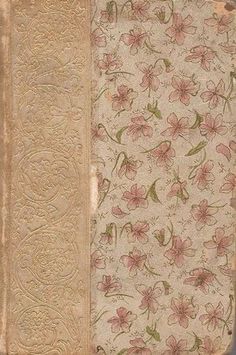 an old book with pink flowers on it