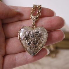 Vintage heart photo locket necklace Signed 1928 Gold tone floral memory locket Long chain necklace Dimensions Chain - 71 cm / 27.95 inches The chain is not adjustable Locket - 3.1 * 4.2cm / 1.22 * 1.65 inches Signed - 1928 Condition - This item is vintage, not new and may show some signs of wear or use. Please ask questions if you have any doubt of an items condition. ! Please make sure to review an item listing description carefully, examine photos, and read my 'Shipping Policies' before making Lockets Necklace, Heart Photo, Memory Locket, Vintage Lockets, Long Chain Necklace, Photo Locket