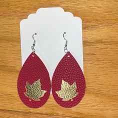 Brand New Customized/Handmade Faux Leather Earrings- Perfect For The Fall Season! Super Cute And Light Weight- 2.5 Inches Long- Colors Are Gold And Red With Cutout Maple Leaf Detail Hypoallergenic Earring Hooks: These Fish Earring Hooks Are Made Of 925 Silver-Plated Copper, Earring Backs Are Made Of Clear Silicone. Questions?! Just Ask! Christmas Faux Leather Earrings, Earrings Fall, Gold And Red, Hypoallergenic Earrings, Earring Hooks, Leather Earrings, Earring Backs, Fall Season, Maple Leaf