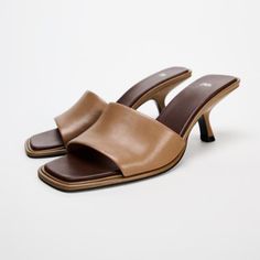 Heeled Leather Mules. Wide Front Strap. Contrasting Color Insole And Asymmetric Heel. Squared Toe. Heel Height: 2.4 Inches (6 Cm) Brand Zara Color Brown | 1303/410 Composition Upper 100% Sheep Leather Lining 100% Polyester Sole 100% Polyurethane Thermoplastic Insole 100% Polyurethane Condition New With Tag New In 2024 Zara Mules, Zara Sandals, Rope Sandals, Zara Heels, Square Toe Sandals, Genuine Leather Sandals, Woven Sandals, Zara Leather, Black Leather Flats