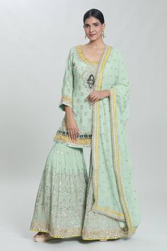 Green padded kurta with sequin pearl embellished, floral paisley zardozi embroidered patterns. Comes with can can attached sharara and dupatta. - Aza Fashions Semi-stitched Pista Green Sharara With Dabka Work, Pista Green Semi-stitched Sharara With Dabka Work, Festive Pista Green Sharara With Dabka Work, Unstitched Pista Green Sharara In Chinon, Pista Green Palazzo Set With Dabka Work In Georgette, Semi-stitched Pista Green Chinon Palazzo Set, Pista Green Sharara With Dabka Work And Traditional Drape, Pista Green Sharara With Dabka Work, Unstitched Pista Green Sharara With Gota Work