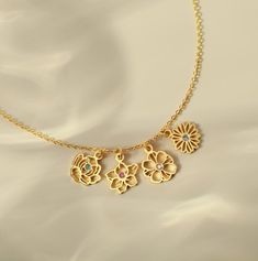 "Surprise mom with our exquisite Birth Flower Bouquet Necklace, a truly meaningful gift on Mother's Day. Each delicate flower charm is adorned with a shimmering birthstone. Perfect for Mother's Day or Christmas, this elegant necklace encapsulates the beauty of family ties and cherished memories. A timeless keepsake, it reflects the love, joy, and connection shared within the family. ► PRODUCT INFORMATION * Material: High Quality Solid 925 Sterling Silver * Finishing: Silver, Gold-plated, Rose gold-plated * Dimension:  Birth flower measure approx 9-10mm * Maximum 8 birth flowers each necklace * All of our jewelry are handmade from scratch and packaged with care in our workshop. * Product is safe for sensitive skin. ► HOW TO ORDER & ADD PERSONALIZATION * Select your preferred color, necklace Anniversary Charm Necklaces With Birth Flower For May Birthstone, Dainty Birthstone Necklace With Flower Charm For Anniversary, Elegant Flower Charm Birthstone Necklace For May, Flower Pendant Birthstone Necklace For May Anniversary, Anniversary Birthstone Necklace With Flower Pendant, May Birthstone Flower Pendant Necklace For Anniversary, Elegant May Birthstone Necklace With Flower Charm, Anniversary Delicate Flower Charm Necklace, Anniversary Birthstone Necklace With Flower Charm