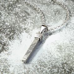 This Sterling Silver Tipped Meteorite Rod Necklace gives you a chance to carry a little slice of space with you wherever you go. For the person who has everything this unique pendant will highlight your individual style with a piece of natural history round your neck. Consisting of a rectangular rod of meteorite set in a sterling silver tip. This makes a beautiful piece of jewellery and a talking point all in one!. If you've ever yearned to own something from out of this world, here's your chance. Over 100,000 years ago, a handful of these mysterious Muonionalusta meteorites impacted earth. Searches for the impact crater from the original shower have been in vain; the site where these specimens are found is in a remote area of northern Sweden, it is presumed they were carried there by glac Impact Crater, Meteorite Jewelry, Crystal Formations, Extra Terrestrial, Sea Glass Necklace, Cluster Pendant, Unique Pendant, Spiritual Jewelry, Green Tourmaline