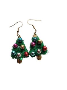 christmas tree earrings with ornaments hanging from them