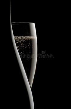 a glass filled with water and bubbles on a black background royalty images, stock photos