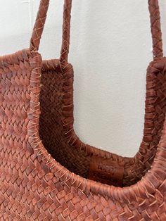 Introducing our handwoven leather tote Narmada bag, meticulously crafted from leather weaving straps in India. This spacious yet elegant accessory is the epitome of convenience and sustainability. Perfect for your everyday life from work to grocery shopping, it effortlessly carries all your essentials with ease. With its eco-friendly material and artisanal craftsmanship, it's not just a bag—it's a statement of conscious living. Embrace practical luxury with our gorgeous tote, where functionality Conscious Living, Brown Bag, Leather Weaving, Brown Bags, Scarf Jewelry, Elegant Accessories, Grocery Shopping, Open Top, Bottom Clothes