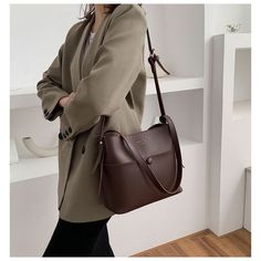 Keep it simple yet chic with this timeless handbag. This classic style goes well from one season to the next. Comes in four fabulous color styles from which to choose. Woman Office, Casual Crossbody Bag, Minimalist Bag, Leather Belt Bag, Black Camel, Leather Bag Women, Leather Bags Handmade, Leather Bucket, Timeless Handbag