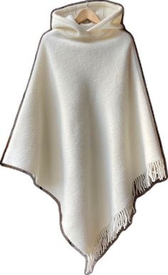 White Winter Poncho Cape, Cozy Winter Poncho With Fringe, White Cozy Winter Poncho, Cozy Winter Cape Poncho, Oversized Fringe Cape For Winter, Cozy White Poncho For Fall, Beige Winter Shawl Cape, Oversized White Cape Poncho, Beige Shawl Cape For Winter