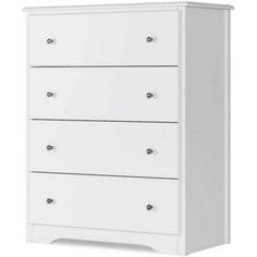 a white dresser with four drawers and two doors on the bottom drawer, in front of a