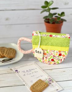 a cookie bag sitting on top of a white table next to a plate of cookies