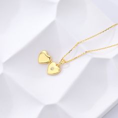 Our new Heart Mini Locket Necklace is a dainty way to celebrate the love in your life! This tiny, yet meaningful necklace opens with space inside for two initials - perfect for you and your partner as a reminder that it all started with you falling in love. Or, engrave any two initials that are special to you! locket can be engraved inside with one initial per side (uppercase only) hangs on adjustable cable chain locket measures 12 x 10mm gold vermeil and sterling silver lockets have a cubic zir Chain Locket, Matching Couple Rings, Meaningful Necklace, Clover Jewelry, Picture Necklace, Ring Bracelet Chain, Sterling Silver Locket, Trending Necklaces, New Heart