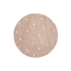 a round rug with white polka dots on the bottom and light pink ground, in front of a white background