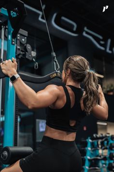 a woman doing squats in the gym