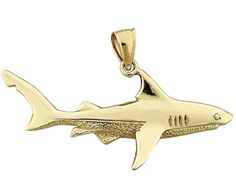 This lavish 14k gold shark pendent, measuring 46mm wide, is a marvelous adornment from our fierce collection of shark-inspired designs. The shark is formed with exactitude and thoughtfulness, flaunting burnished surfeaces and delicate features that incarnate the predator. Its multifaceted and grooved configuration is hyperrealistic, presenting the majesty of these spectacular creatures. Whether appended to an oceanic or maritime-themed necklace, this pendent is an exceptional embellishment that Shark Pendant, The Predator, Delicate Features, The Shark, Textured Design, Fine Jewellery Necklace, Jewelry Plate, Intricate Details, Gold Chains