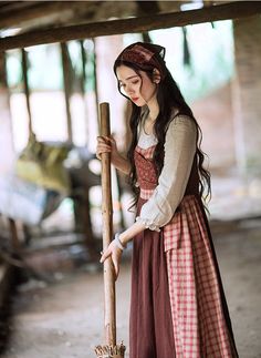 Early 19th century inspired village dress for everyday chores. This faux multi-layered dress features a white blouse part with a scoop neckline and three-quarter blouson sleeves, and a pinafore dress with plaid and ditsy floral patchwork layers. We've deliberately designed the floral patchwork to slant towards one side and attached it with an adjustable lace-up. There's a little pocket dangling at the waist to keep your phone or other knick-knacks. Full knit plaid skirt and partial linen brown s Layered Apron, Pretty Cosplay, Village Dress, Character Appearance, Knit Plaid, Dress For Everyday, Brown Skirt, Floral Patchwork, Pretty Ppl