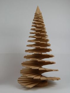 a wooden christmas tree made out of wood strips