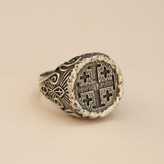 Jerusalem Ring 925 Sterling Silver Handmade Ring The details of Jerusalem Cross were made in order to make it look like carved inside a wood. There's Holy Trinity symbol at the bottom of the sides and a shining Cross above. In the middle sides of the ring, Templar Cross was engraved. The design is open for your customization as you would like... We ship our products with UPS express (within 3-5 days delivery) The production time is 2-3 business days. All sizes are available, please just tell me Sterling Silver Artisan Engraved Ring, Heirloom Carved Sterling Silver Engraved Ring, Artisan Silver Engraved Ring, Artisan Engraved Signet Ring For Anniversary, Artisan Engraved Sterling Silver Signet Ring, Antique Engraved Sterling Silver Ring, Artisan Carved Silver Rings, Artisan Silver Engraved Ring With Carved Details, Carved Sterling Silver Signet Ring