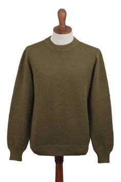 Designed by Peru's Zoila Olaechea this gorgeous men's sweater is made from pima cotton in a solid olive green tone and features a crew neck. With a fit that is great for casual styling this sweater will become your go-to item. You will love the natural texture and color. Classic Green Textured Knit Sweater, Green Tone, Green Tones, Retro Tshirt, Men's Sweater, Cotton Sweater, Natural Texture, Pima Cotton, Casual Style