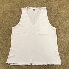 A Brand New Top From Madewell, Size Medium. It’s A Classic Boyfriend Style Tank Top With A Front Pocket, A V-Neck. Everyday Cotton V-neck Tank Top, Casual V-neck Tank Top For Loungewear, Casual V-neck Tank Top For Everyday, Everyday V-neck Tank Top, Relaxed Fit Cotton V-neck Tank Top, Cotton V-neck Tank Top For Loungewear, White Casual V-neck Tank Top, Casual White V-neck Tank Top, Everyday Summer V-neck Tank Top