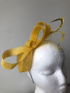 Item: Yellow sinamay loop fascinator with feathers and netting on a silver metal headband!  Size: Approx 10ms high  Postage: The postage in this listing is regular post via Australia Post. Please allow approximately 7-10 days for postage at Australia Post (for metro areas) and more for regional areas.  If you require express post, please purchase here.  https://www.etsy.com/au/listing/208216644/express-post-your-fascinator?ref=shop_home_active_1&ga_search_query=express%2Bpost  Express post via A Cream Fascinator, Double Headband, Fascinator Hats Diy, Metal Headband, Human Head, Fascinator Headband, Silk Headband, Australia Post, Metal Headbands