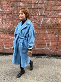 "This coat is handmade from a preowned mid-century wool blanket which deserved a second life. It has signs of use, no stains.  The coat has a classic double notched lapel, drop shoulders, long and straight. It closes with a belt. It has smiley welt patch pockets and no lining. The sleeve cuffs are cinched with kilt pins. The material is 100% wool, the blanket is thick and fuzzy. Width (pit 2 pit with 4\" overlap): 48\" Back length (nape 2 hem): 44\" Sleeve (nape 2 cuff): 31\" Belt length: 72\" Model measurements: bust 35\", waist 28.5\", hip 36\", 5'8 Dry clean/spot clean. One of a kind. any further questions please don't hesitate to contact me!" Blue Wool Outerwear For Winter, Blue Wool Coat With Pockets For Fall, Blue Shawl Collar Outerwear For Fall, Blue Wool Outerwear With Pockets, Blue Wool Coat With Lapel Collar And Pockets, Blue Wool Coat With Lapel Collar, Blue Wool Outerwear For Cold Weather, Oversized Blue Outerwear With Lapel Collar, Blue Long Wool Coat For Fall