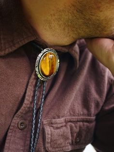 To Order: choose a border style of the pendant, select a cord size (based on your height), and choose a cord color. We have the best selection of high-quality bolo ties. Great for: -Wedding Attire -Date Nights & Dinner Parties -Gifts! 🎁 Wanna win a Free Bolo Tie? 🎟️ Enter our Giveaway! Join the BoloTieStore Email Posse to get: ⮞Giveaway invites (Every Month!) ⮞$5 off a bolo tie coupon ⮞Exclusive sales, discounts, & new designs You can join here: www.bolotiestore.com Here's why BoloTieStore is Luxury Handmade Bolo Ties As Gift, Dinner Party Gifts, Radium Girls, Date Night Dinners, Tie Sweater, Bolo Ties, Bolo Tie, Cabochons Stones, Tie Accessories