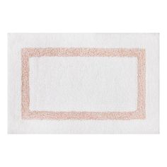 a white rug with an orange border on the top, and a light pink border on the bottom