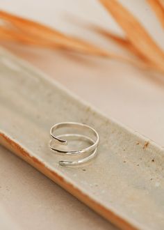 This wrap ring looks like two stackers that magically stay the perfect distance apart. Like friends, not lovers. Heavier gauge half-round wire is shaped and hammered for texture. Available in 14kt Gold Fill + Sterling Silver. Handmade in Eau Claire, WI All of our jewelry is handmade to order just for you so each piece will be unique and may vary slightly from what is pictured. Jewellery Workshop, Copper Uses, Everyday Wear Jewelry, Silver Wrap Ring, Rings Handmade, Jewelry Workshop, Wrap Ring, Handmade Jewelry Designs, Wrap Rings