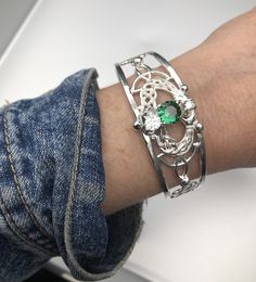 I will fabricate this gorgeous statement Celtic Triquettra and Claddagh design bracelet cuff in 925 sterling silver. It signifies the three, or the family. It also represents protection. Celtic knots represent spiritual unity with the divine - a connection that shall cannot be broken like in a circle. This wide array of interpretations reminds us that the meanings of these engaging knots are not set in stone...or sometimes they are. The very fact that the Celtic knot meaning is so elusive makes Formal Sterling Silver Cuff Bracelet, Sterling Silver Cuff Bracelet For Anniversary, Sterling Silver Hand Set Cuff Bangle, Hand Set Sterling Silver Cuff Bangle, Hand-set Sterling Silver Cuff Bangle, Sterling Silver Cuff Bracelet With Intricate Design, Silver Cuff Bracelet Fine Jewelry For Gift, Silver Bangle Bracelet For May Birthstone, Silver Sterling Silver Cuff Bracelet