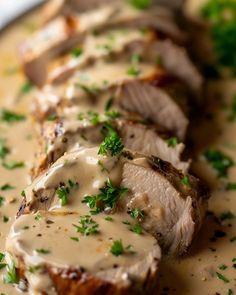 sliced pork with gravy and parsley on top