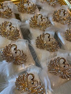 there are many pieces of jewelry on display in the case, including tiaras and brooches