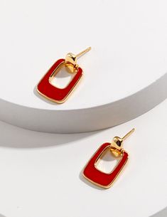 Retro Style Gold Earrings with Red Drop Glaze that looks stunning and elegant Modern Rectangular Stone Earrings For Gifting, Modern Earrings With Rectangular Stone Gift, Modern Earrings With Rectangular Stone For Gift, Elegant Metal Oblong Earrings, Chic Rectangular Earrings As Gift, Chic Rectangular Earrings For Gift, Trendy Rectangular Jewelry With Matching Earrings, Trendy Jewelry With Matching Rectangular Earrings, Modern Rectangular Pendant Earrings As Gift