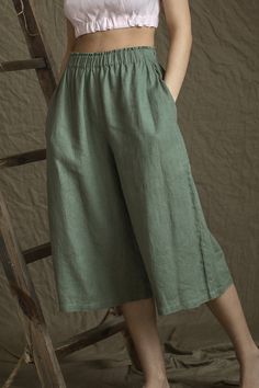 "Simple and natural, but flattering and super comfortable. Walk with grace and elegance in these LGlinen culottes. ITEM DETAILS: - Loose and roomy pants with wide leg - Midcalf length - Hidden and deep pockets at side seams - Pants inside leg length - 45.5cm (18\" ). - Wide elastic waistband - Made from certified by OEKO-TEX standard 100% medium weight European linen, with no human harmful substances - Item quality washed -means no shrinkage in future wearing and caring Could be made custom leng Spring Linen Bottoms Solid Color, Spring Solid Color Linen Wide Leg Pants, Relaxed Fit Culottes With Pockets, Summer Ramie Bottoms, Non-stretch Linen Wide Leg Pants For Loungewear, Relaxed Fit Linen Wide Leg Pants In Solid Color, Relaxed Fit Solid Color Linen Wide Leg Pants, Wide Leg Flax Bottoms For Spring, Green Linen Wide Leg Pants With Elastic Waistband