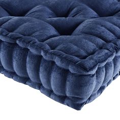 the blue velvet mattress is made from thick, plush material and has a square shape