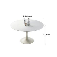 a white table with two bottles on it and measurements for the height of the table