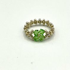 Fun Handmade Ring Made Of Silver Seed Beads And Green Swarovski Crystals. Dress Up Any Outfit With This Fun Ring. Any Size Available. If You Don’t See Your Size Here Let Me Know And I’ll Add It In. Handcrafted By Me So Each Piece Is Brand New. Your Item Is Beautifully Packaged With Care And Shipped The Next Business Day. Materials: Swarovski Crystals 4mm Seed Beads 11.0 Beading Thread Swarovski Crystals Dress, Crystals Dress, Beading Thread, Bead Projects, Beaded Ring, Swarovski Crystal Beads, Beaded Jewelry Patterns