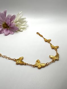 This stunning stainless steel gold butterfly bracelet is a masterpiece of elegance and sophistication. Adjustable to fit any wrist, its high-quality construction ensures a comfortable and durable wear. The delicate butterfly design adds a touch of whimsy and romance, making it a perfect accessory for any occasion. Adjustable Butterfly Shaped Yellow Gold Jewelry, Adjustable Gold Butterfly Jewelry, Adjustable Butterfly Gold Jewelry, Elegant Gold Bracelets With Butterfly Clasp, Elegant Gold Bracelet With Butterfly Clasp, Gold Butterfly-shaped Metal Jewelry, Gold Butterfly Metal Jewelry, Adjustable Gold Jewelry With Butterfly Charm, Adjustable Gold Bracelets With Butterfly Clasp