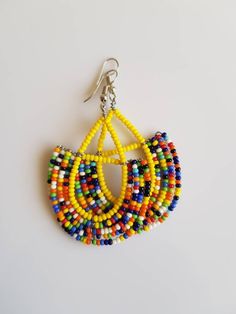 This listing is for ALL 9 pairs. The earrings are 100% handmade using original fine beads. Colorful and bright colors. ^^These earrings ships through dhl express. Buy multiple items and pay shipping for ONE item ONLY. Handmade Multicolor Traditional Hoop Earrings, Handmade Traditional Multicolor Hoop Earrings, Handmade Colorful Beaded Round Earrings, Traditional Handmade Multicolor Hoop Earrings, Adjustable Multicolor Wrap Earrings With Ear Wire, Colorful Traditional Earrings, Multicolor Drop Wrap Earrings, Handmade Earrings With Round Beads For Festivals, Multicolor Beaded Earrings For Festivals And Gifts