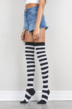 Black and White Striped Thigh High Socks Elevate your style with our luxurious striped thigh high socks. Indulge in the soft hand feel of our slim-fitting design, carefully crafted with a blend of combed cotton. Easy to wear and lightweight, they are the perfect finishing touch to your outfit. Elevate your everyday look with these bold, yet elegant socks. Details: features: • Lightweight • Allover Striped • Breathable material & care: • Material content: Combed Cotton; Polyester; Spandex; Elasta Striped Knee-high Socks For Stocking Stuffers, Fitted Striped Knee-high Socks, Striped Knee-high Winter Socks, Striped Stretch Socks For Winter, Knee-high Striped Winter Socks, Stretch Striped Socks For Winter, Winter Striped Knee-high Socks For Stocking Stuffers, Striped Socks For Winter Stocking Stuffer, Striped Socks For Stocking Stuffers In Winter