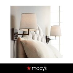 a bed with two lamps next to it and the words macy's above it