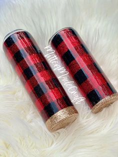 two red and black plaid glass bottles with gold glitter accents