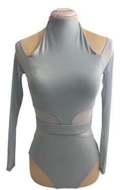 a woman's bodysuit with long sleeves and an open back, on a mannequin dummy