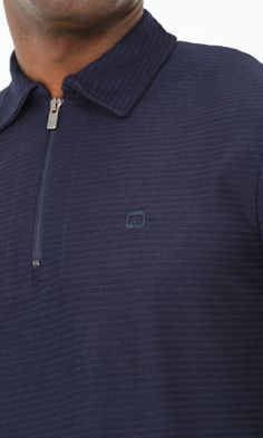 QL Relaxed Polo Zip Up S24 in Navy Blue Description: Navigate the warmest months in style by adding QL Relaxed Polo Zip Up S24 to your summer wardrobe. Made from breathable slightly elasticated ribbed fabric perfect for the hot weather. It is very versatile and can be dressed up for a business casual look or dress down for the weekend allowing you to transition from a casual to a semi-formal look effortlessly. Modern Islamic clothing for men High quality ribbed fabric Classic polo shirt with a s Modern Islamic Clothing, Islamic Clothing, Formal Looks, Hot Weather, Casual Look, Trendy Tops, Hoodie Top, Ribbed Fabric, High Collar