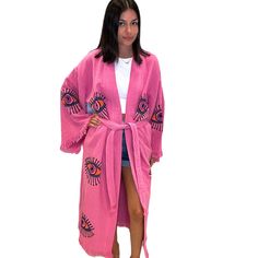 Add some bold color to your wardrobe with the Eye Kimono in hot pink. a vibrant and eye-catching piece for your summer wardrobe. Featuring a playful multi-eye print and a flowing silhouette, this kaftan exudes laid-back charm and effortless style. Shown with shorts, but also great for a beach cover up, and robe. Shop more Kimonos Hot pink One size Kimono Long sleeves Tie waist Fringe detail Lightweight Soft Handmade 100% organic cotton Pink Kimono For Beach Cover-up, Pink Kimono For Beach Cover-up During Beach Season, Pink Summer Loungewear Cover-up, Pink Summer Kaftan For Beach Cover-up, Spring Printed Kaftan For Loungewear, Spring Pink Printed Kimono, Pink Vibrant Print Kaftan For Vacation, Vibrant Spring Kaftan With Kimono Sleeves, Vibrant Kaftan With Kimono Sleeves For Spring