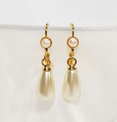 "Bridal Pearl Earrings, Pearl Stud Earrings, Bridal Earrings, Bridal tear drop pearl earrings, Wedding accessories, Gold and pearl jewelry for the bride. The bridal pearl earrings, features Swarovski teardrop pearl with a stud gold coated earring, and tiny Swarovski pearl inlay. The studs can be replaced with a hook hanging earring also with Swarovski pearl inlay. (Appear in the fourth photo). The design is very delicate, made with fine 24K gold plated earrings, NICKEL FREE. You can choose your Classic White Bridal Earrings With Elegant Design, Classic White Teardrop Earrings For Wedding, Classic Pearl Teardrop Dangle Earrings, Classic Pearl White Teardrop Bridal Earrings, Classic Pearl Drop Bridal Earrings, White Pearl Charm Bridal Earrings For Evening, White Teardrop Pearl Earrings For Evening, Classic Pearl White Drop Bridal Earrings, Formal Pearl Teardrop Earrings