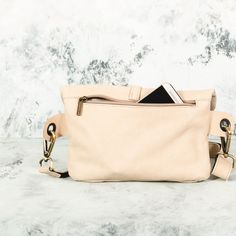 This Beige Leather Fanny Pack is the ideal bag if you like carrying all your necessities, keep your hands free and look effortlessly fashionable at the same time! Perfect for festivals, markets and travelling. Simple and beautiful bag made of a high quality Italian leather, which is soft to touch, strong, durable and a very fine material. Top grade thicker leather is used for the adjustable belt. This hip bag features one separate compartment closed by a zipper in the back and another zippered p Multifunctional Crossbody Bags For On-the-go, Multifunctional Crossbody Belt Bag For On-the-go, On-the-go Bag With Zipper Pocket And Pouch Shape, Trendy Chest Bag For Everyday Use, Multifunctional On-the-go Pouch Bag, Versatile Belt Bag With Detachable Strap, Trendy Chest Bag Pouch For Daily Use, Beige Crossbody Belt Bag For On-the-go, Trendy Chest Pouch Bag For Daily Use