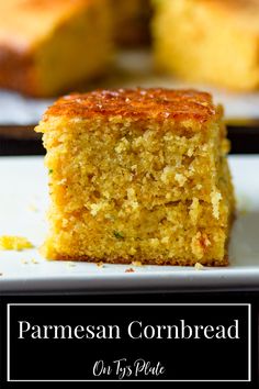 a close up of a piece of cake on a plate with the words parmesan cornbread